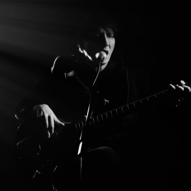 Close-up image of Gavin Lambert from Some Velvet Morning's 'Love Begins' video.